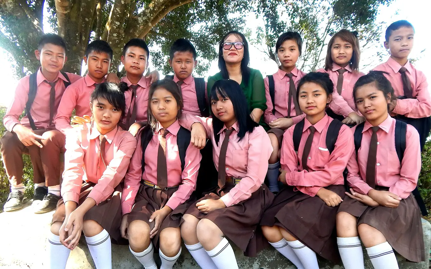 Students in school uniform with their teacher
